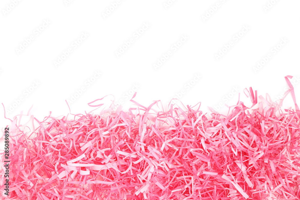Pink shredded paper on white background