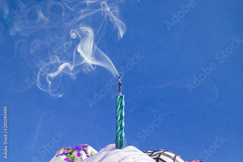 Vászonkép Smoke rising out of blown out candle