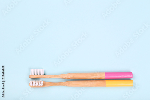Bamboo toothbrushes on blue background