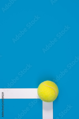 Big tennis ball on blue background In or out challenge hard court © allasimacheva