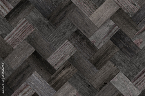 Wood texture for background. Dark parquet floor with herringbone pattern.