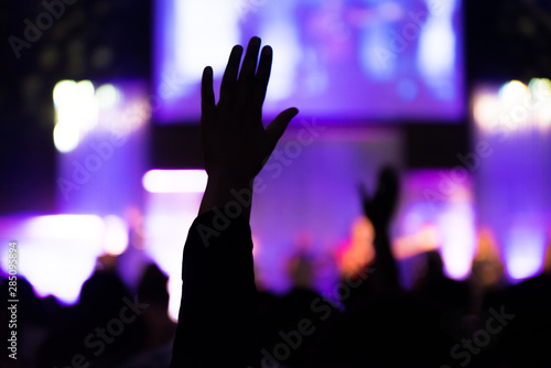 Silhouette of Human Hands Raised at Church