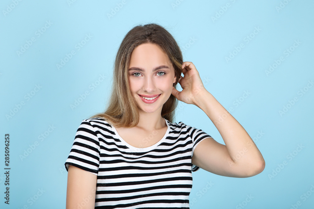 Beautiful young woman on blue background Beautiful young woman on blue background