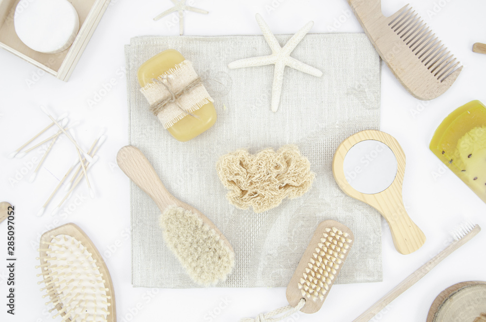 Flat lay arrangement with wooden brushes and mirror Flat lay arrangement with wooden brushes and mirror