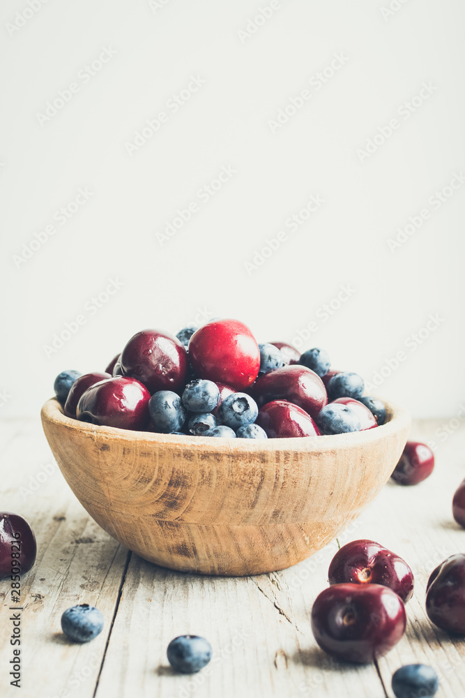 Bowl of ripe cherries and blueberries Bowl of ripe cherries and blueberries