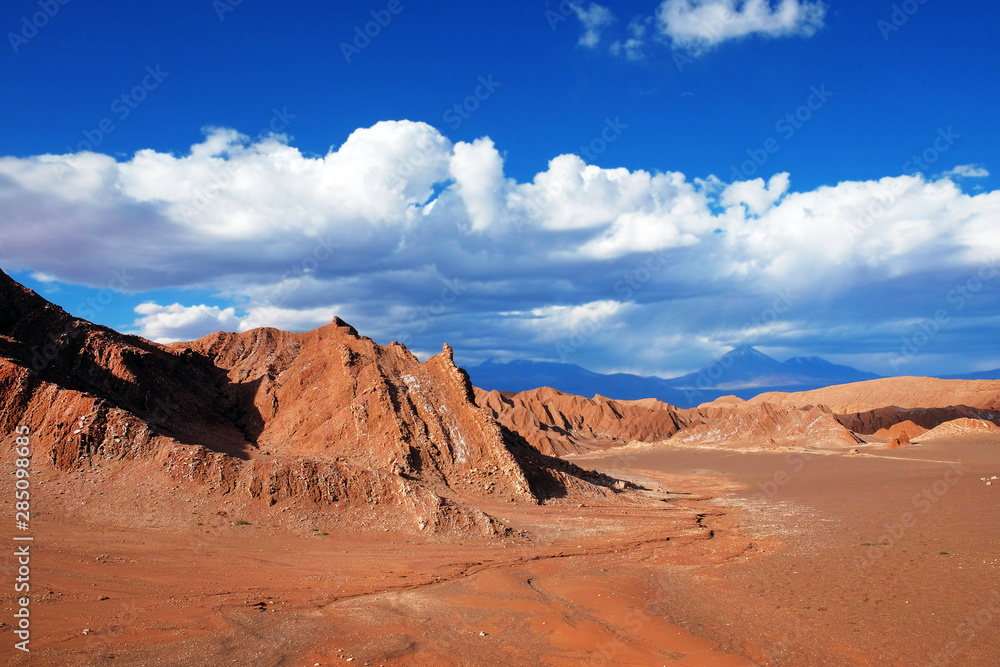 View of the Mars Valley near San Pedro de Atacama against a blue dramatic sky. View of the Mars Valley near San Pedro de Atacama against a blue dramatic sky.