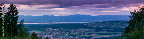 Evening panorama view from the top of the French town Bons-en-Chablais, lake Geneva(lake Leman) and the mountains in Switzerland.Department of Haute-Savoie,region of Auvergne-Rhone-Alpes in France.