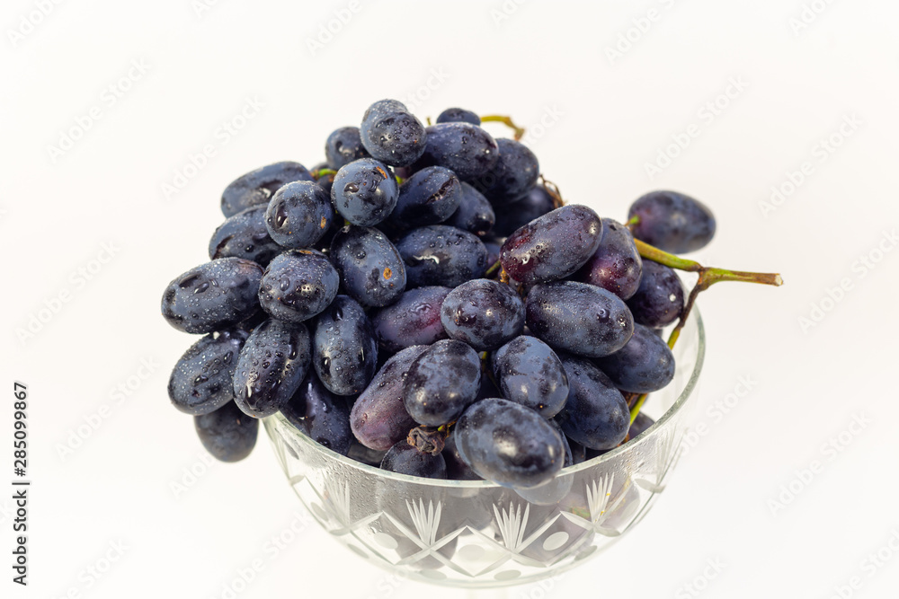 bunch of grapes with water drops close-up on white background bunch of grapes with water drops close-up on white background