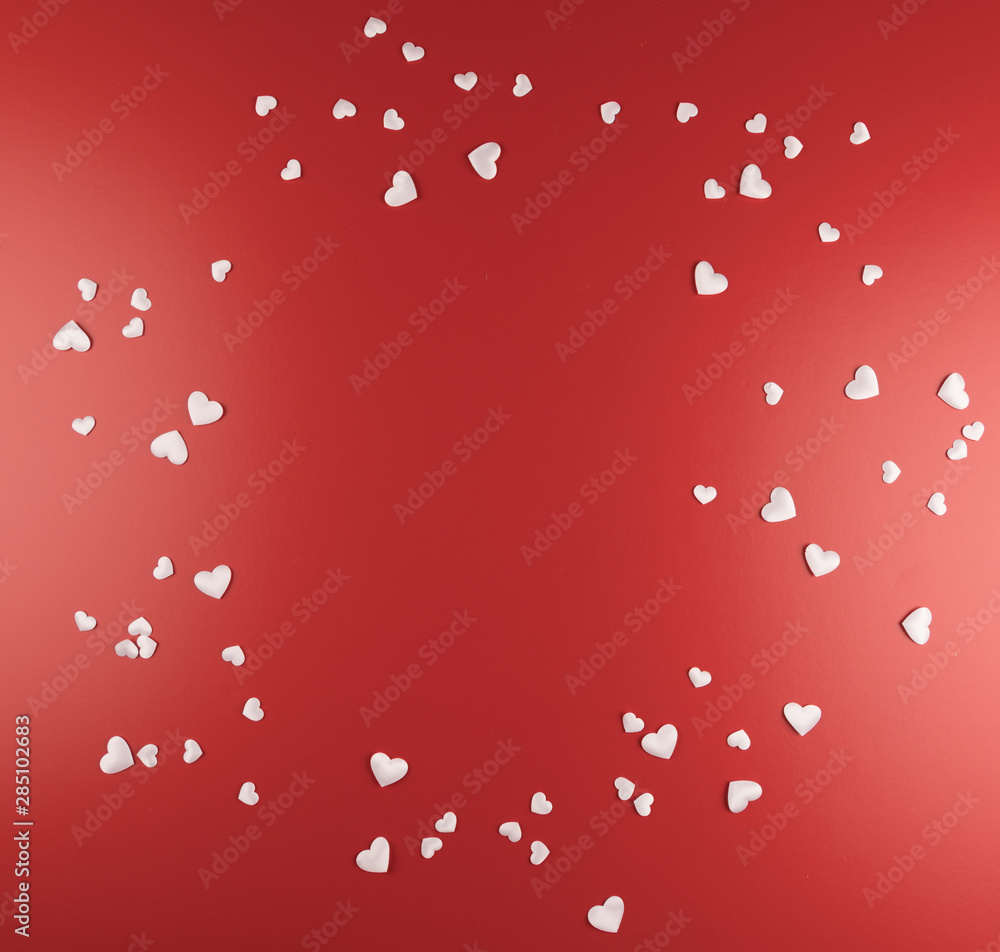 Hearts Scattered on Red Background, copy space