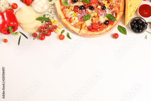 Flat lay. Pizza and ingredients: vegetables, cheese on white background, copy space