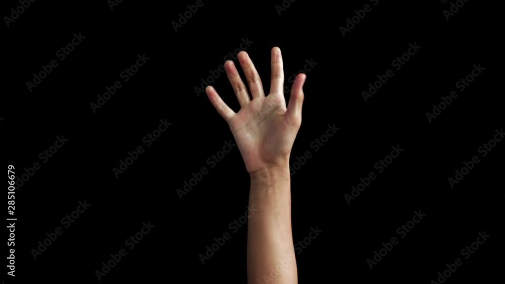 SINGLE HANDED AMERICAL SIGN LANGUAGE DEMONSTRATION OF T ALPHABET BY MALE TEENAGER'S HAND BY COMING UP ON BLACK BACKGROUND ISOLATED. SINGLE HANDED AMERICAL SIGN LANGUAGE DEMONSTRATION OF T ALPHABET BY MALE TEENAGER'S HAND BY COMING UP ON BLACK BACKGROUND ISOLATED.