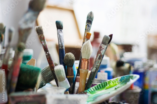 France, Paris, Brushes in artist's studio photo