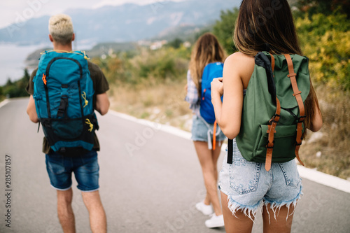 Group of happy friend traveler walking and having fun. Travel lifestyle and vacation concept