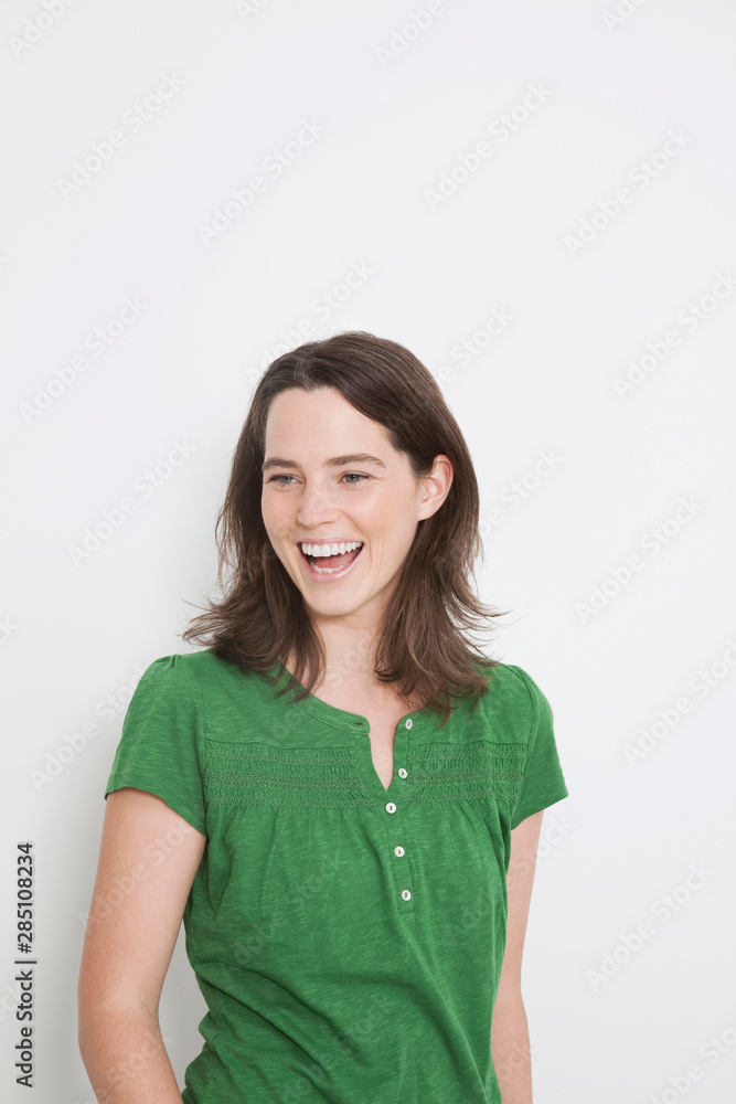 Woman looking away, smiling. Woman looking away, smiling.