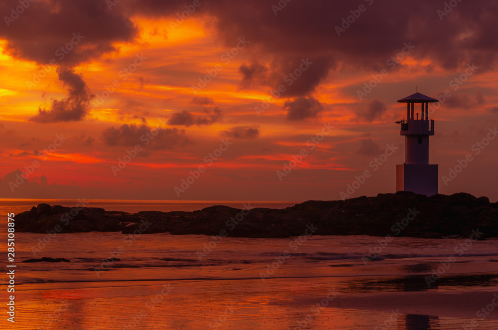 Iconic lighthouse with sunset twilight atmosphere and beautiful colorful sky after sunset.