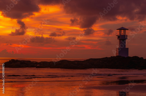 Iconic lighthouse with sunset twilight atmosphere and beautiful colorful sky after sunset.