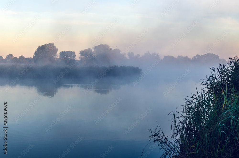 Morning landscape with fog over the lake Morning landscape with fog over the lake