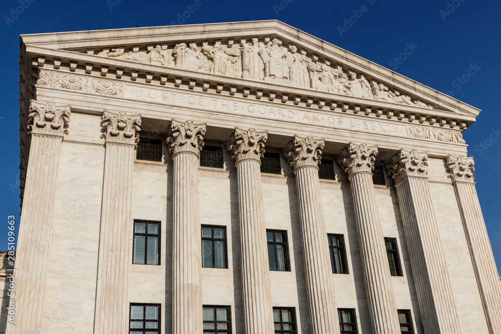 Supreme Court of the United States rear facade. Justice The Guardian Of Liberty is printed below the cornice I