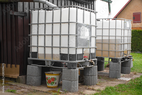 Plastic water tank in the garden for rainwater 