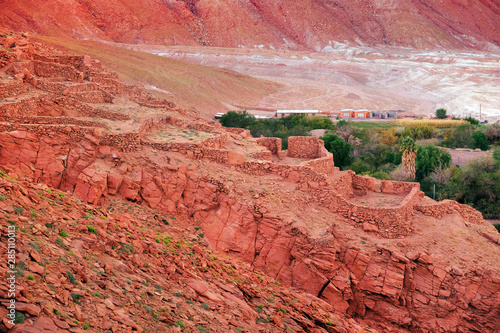 Desert landscape of the archeological village Pukara de Quitorand near San Pedro de Atacama, Chile, and buildings froma nearby village. photo