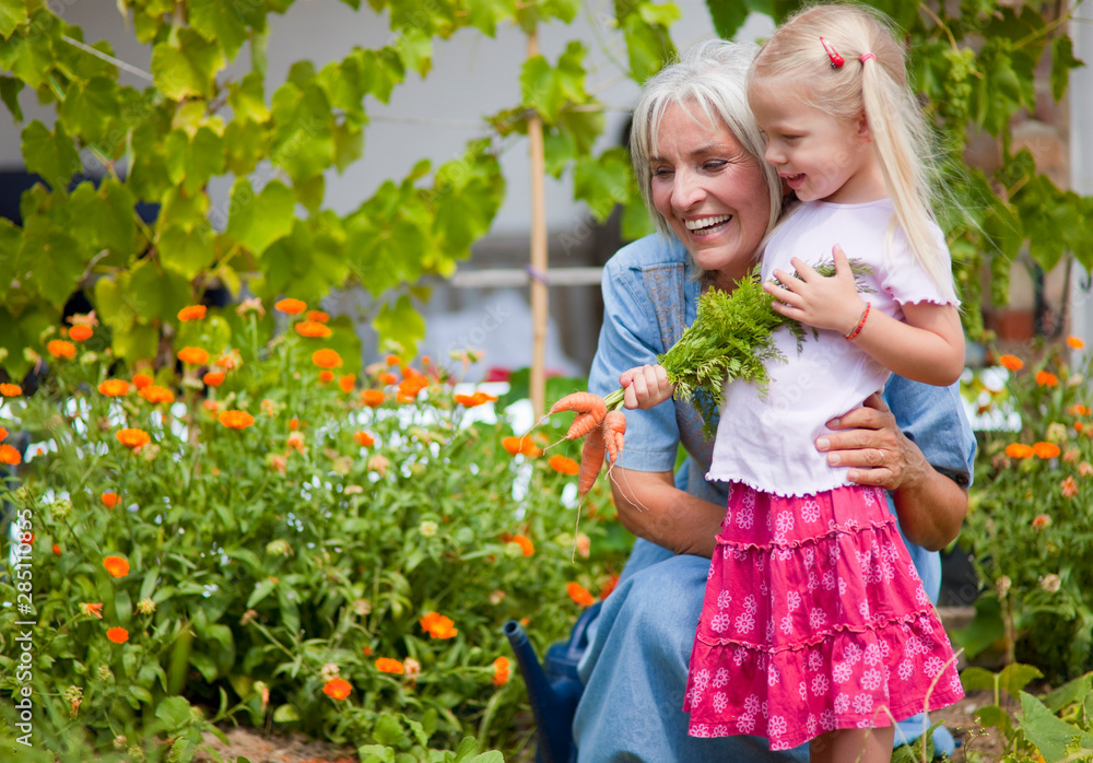 Germany, Bavaria, Mature woman with girl in garden Germany, Bavaria, Mature woman with girl in garden
