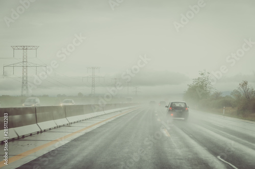 misty road during rainy day