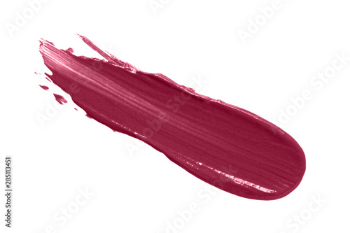 Lipstick smear smudge swatch isolated on white background. Cream makeup texture. Color cosmetic product brush stroke swipe sample