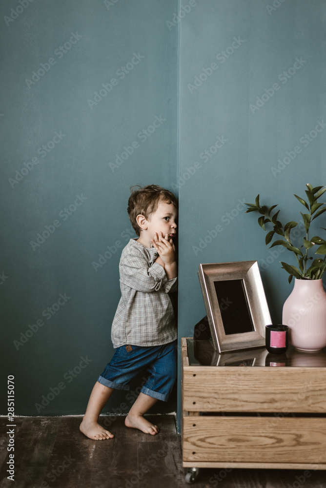 Little boy?standing in corner of room Stock Photo Adobe Stock