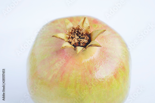 Juicy pomegranate. Isolated on a white background. photo