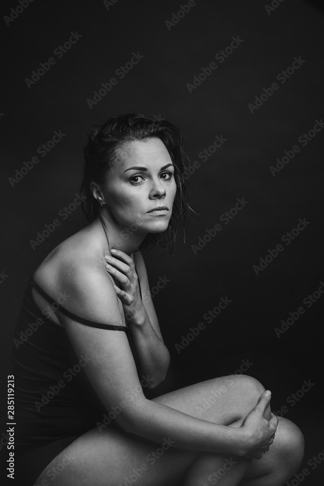 Black and white portrait of a young pensive woman Black and white portrait of a young pensive woman