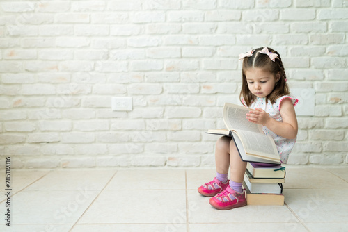 Toddler Learning To Read Books At Home