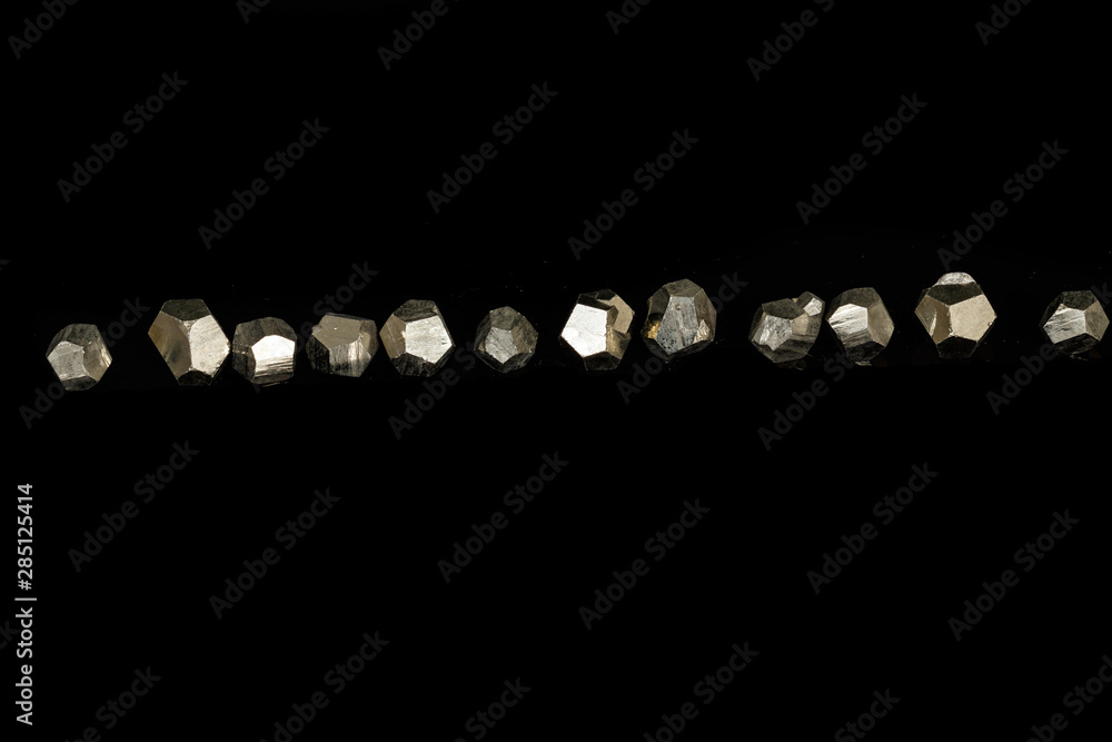 Macro mineral stone Pyrite on a black background Macro mineral stone Pyrite on a black background