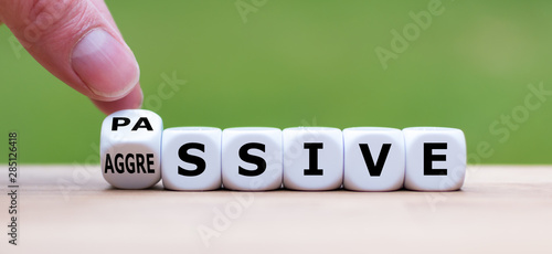 Hand turns a dice and changes the word 