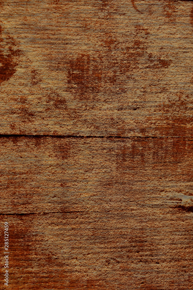 Naklejka premium old wood plank with crack brown vintage wallpaper close up