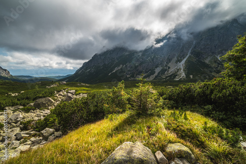 Sunlit Mountain Landscape with Clouds. Mengusovska Valley, High Tatras, Slovakia photo