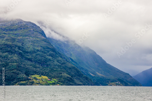 clouds over the fjord and mountains in Norway