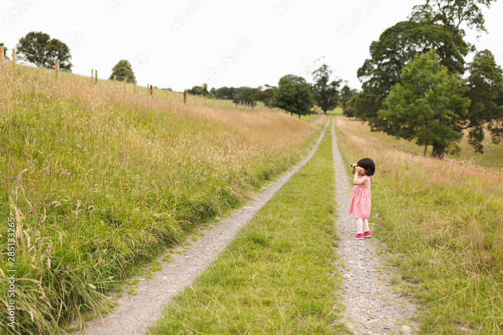 toddler girl playing exploration at sunny summer countryside,Northern Ireland toddler girl playing exploration at sunny summer countryside,Northern Ireland