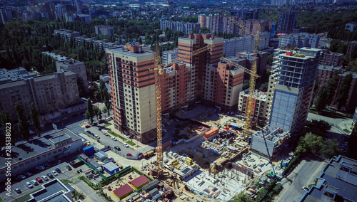 New residential complex under construction area with a developing infrastructure. house under construction. modern urban building under construction with a crane