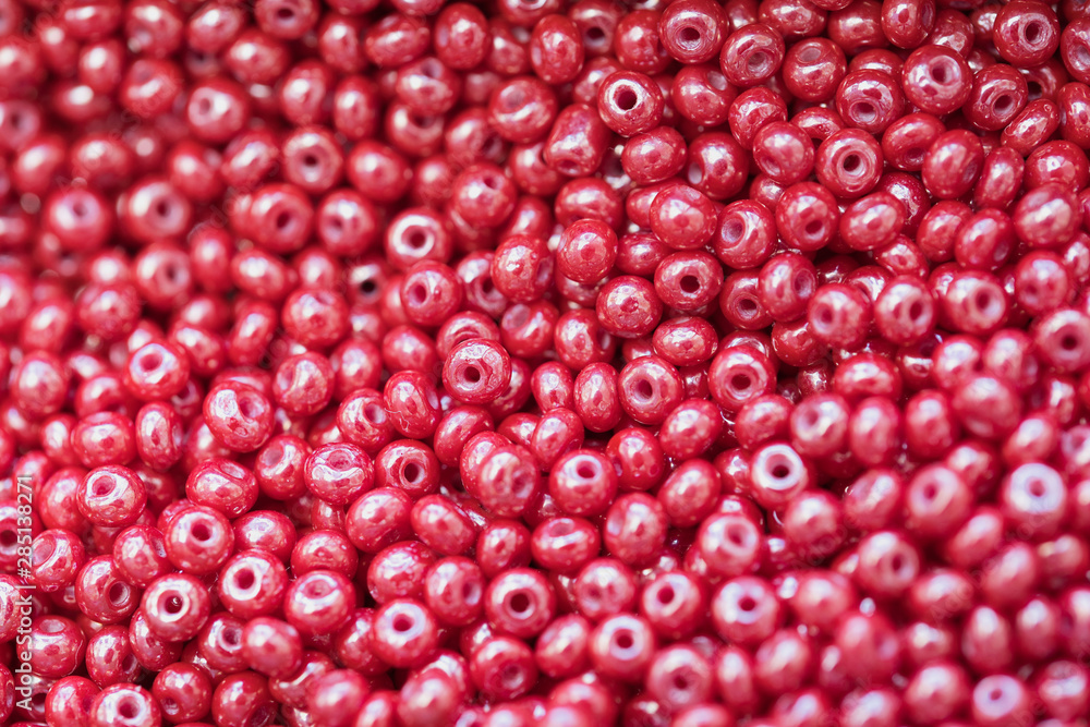 macro photo of red shiny plastic beads as background macro photo of red shiny plastic beads as background