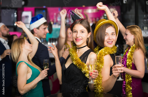 Young females and males celebrating new year