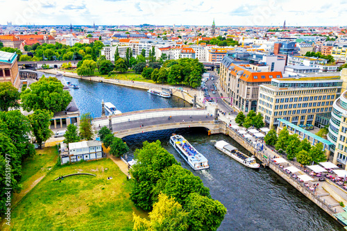 Skyline aerial view of Spree River and Museum island in Berlin city, Germany. Berlin touristic tour boats on the river. View from Berliner Dom