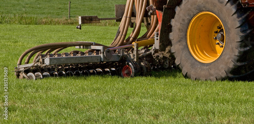 Dunging. Injecting manure in meadow. Netherlands. Farming. Fertilizing