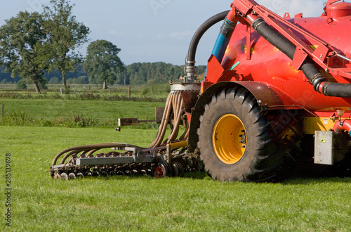 Dunging. Injecting manure in meadow. Netherlands. Farming. Fertilizing