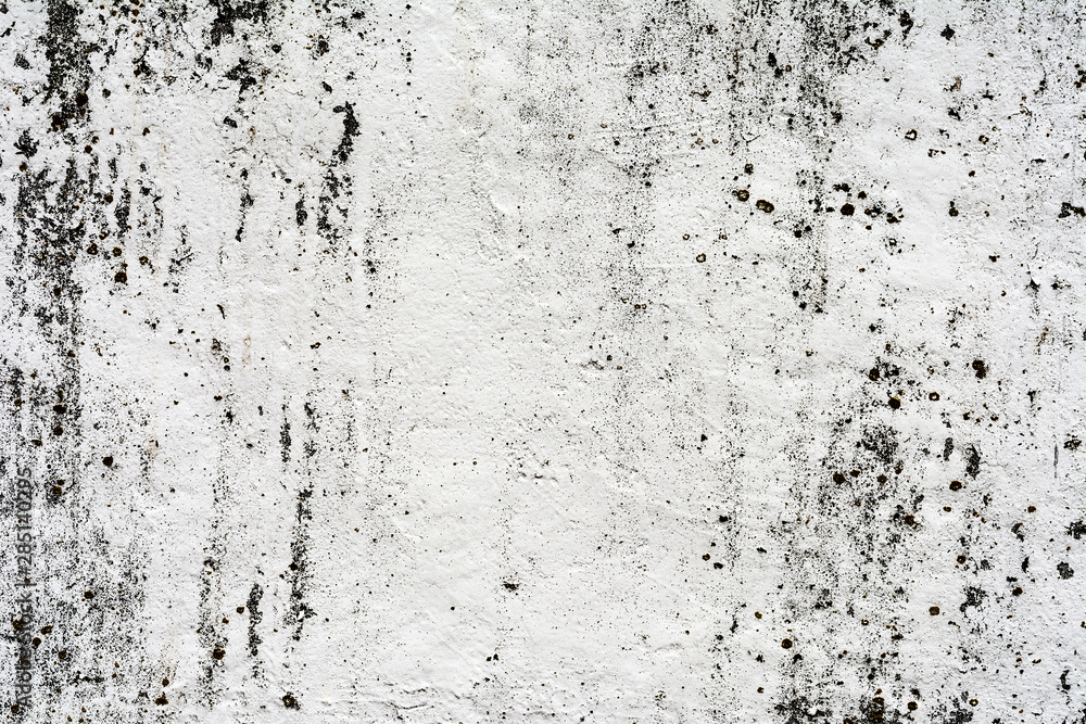Fototapeta premium texture of an old wall with uneven cracked stucco, dirty surface of the exterior painted wall