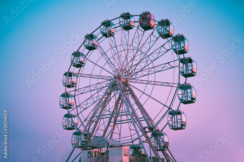 Ferris wheel against the background of the summer sky