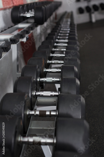 Rows of dumbbells in gym