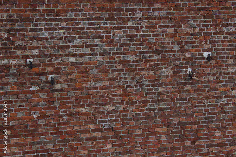 Blurred with resin brick wall background. Texture of contaminated brick wall in tar. - obrazy, fototapety, plakaty 