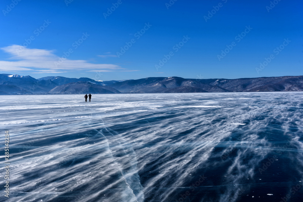 Frozen Lake Baikal. Beautiful mountain near the ice surface on a frosty day. Natural background