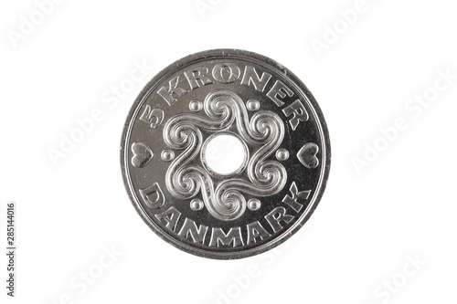 A silver, one Danish krone coin cut out on a clean, white background in isolation.  Shot in close up macro. photo