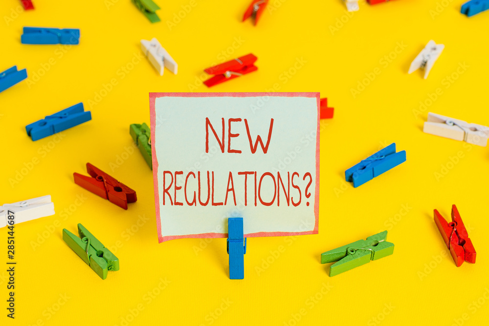 Conceptual hand writing showing New Regulations Question. Concept meaning rules made government order control way something is done Colored clothespin papers empty reminder yellow floor office Conceptual hand writing showing New Regulations Question. Concept meaning rules made government order control way something is done Colored clothespin papers empty reminder yellow floor office